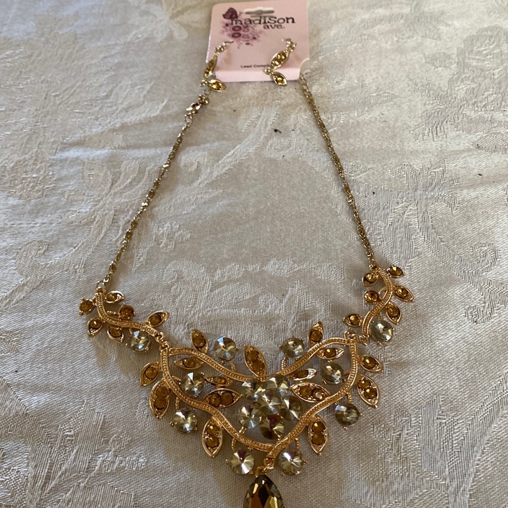 Three- Tiered gold Necklace (costume with matching earrings 
With earrings
